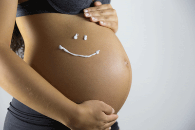 pregnant woman using skin care